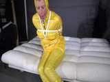 Watch Pia enjoying Bondage in her shiny nylon yellow Rainwear