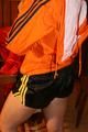 Jill wearing a sexy black nylon shorts and a orange rain jacket while dressing her up (Pics)