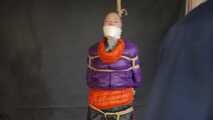 Rachel Adams bound, gagged and double hooded in shiny downjackets