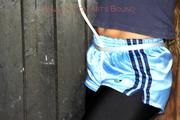 Katharina tied and gagged in shiny nylon shorts