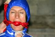 Katharina bound and gagged in shiny nylon rainwear