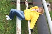 Leonie tied and gagged outdoor wearing a shiny yellow downjacket (Pics)