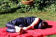 Julia tied and gagged in shiny nylon clothes