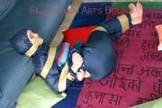 Jill tied, gagged and hooded on the floor with tape wearing an oldschool rain combination (Pics)