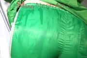 Sonja oiling and rinsing herself in the shower wearing a supersexy green shiny nylon shorts and rain jacket (Pics)