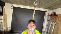 Lana bound and gagged in a shiny nylon Downvest