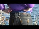 Alina walking in a lake wearing a supersexy purple down jacket and a jeans (Video)