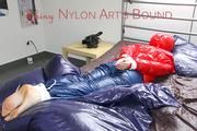 Mara tied and gagged on bed wearing a sexy shiny red down jacket and a blue rain pants (Pics)