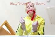 SEXY PIA being tied and gagged on a stairway with cuffs and a cloth gag wearing a sexy red shiny nylon shorts and a yellow rain jacket (Pics)
