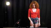 Skinny girl with wild red hair loves smoking a 120mm between the shooting