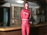one of our archive girl tied and gagged in a shiny nylon rainsuit