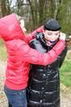 Jill tied and gagged by Petra in a shiny 