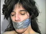 26 Yr OLD K-MART CLERK WRAP TAPE GAGGED WEARING BATHING CAP, MOUTH STUFFED. TIT TIED, CROTCH ROPED, NUDE, GARTER BELT & NYLON STOCKINGS TIGHTLY TIED TO A CHAIR (D63-13)