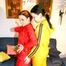 Jill and a friend of her pplaying with eachother wearing yellow and red shiny nylon rainwear (Pics)