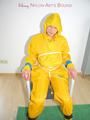 Katharina tied, gagged and hooded on a chair wearing sexy yellow rainwear (Pics)