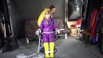 Watching sexy Sandra wearing hot purple shiny nylon rainwear with rubber boots being tied, gagged and hooded from Stella wearing a sexy yellow shiny nylon rainwear with high heels rubber boots (Video)