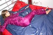 Alina preparing her bed for relaxing and lolling on the bed wearing a sexy shiny nylon rain pants and a rain jacket (Pics)