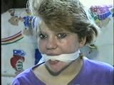 22 Yr OLD LISA IS RUBBER BAND BALL-GAGGED, MOUTH STUFFED, HANDGAGGED, OTM & CLEAVE GAGGED (D43-6)