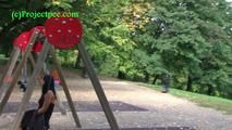 050013 Roxy Sits On A Swing In The Park And Then Pees On The Path