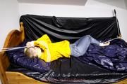 Samanthy bound and gagged in shiny nylon rainwear