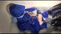 Sonja taking a bath and ties and gagges herself wearing a shiny nylon rainwear combination (Video)