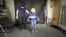 Alice bound and gagged in a shiny nylon Downjacket