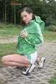 Watching ***OUR SEXY ARCHIVE MODEL JENNY*** wearing a sexy white shiny nylon shorts and a green shiny nylon rain jacket posing for you (Pics)