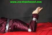 Pia being tied and gagged with tape on a sofa wearing sexy purple shiny nylon downwear (Pics)