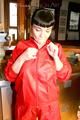 Jill posing sexy in an bar wearing sexy red shiny nylon rainwear (Pics)