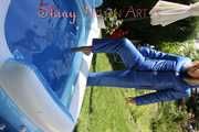 Watching Pia wearing a lightblue downbib and a downjacket playing with the water in the swimming pool (Pics)