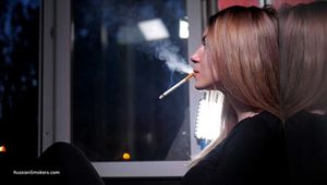 Anya is smoking 120mm Saratoga on the balcony