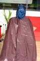 Katharina tied and gagged in a shiny nylon rainsuit