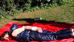 Julia tied and gagged in shiny nylon clothes