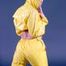 Blonde-haired archive girl wearing supersexy yellow rainwear while posing infront of the camera (Pics)