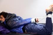 Shelly tied and gagged in shiny nylon pants and a shiny nylon dowjacket