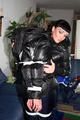 Petra was tied by Jill in shiny downjackets 