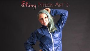 Mara wearing a very hot blue rain skirt and a rain jacket as well as red rubber boots posing for you in a photo studio (Pics)