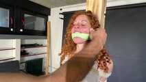 Beautifull Lola Montez tied and gagged very strictly to a post in shiny nylon Shorts