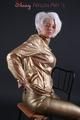 Blonde archive girl posing in a studio wearing a sexy golden rainwear combination (Pics)
