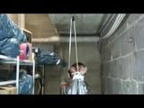 a video with Nicole tied and gagged in a shiny silver PVC sauna suit