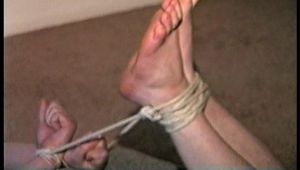 25 Yr OLD NEWS PAPER REPORTER IS MOUTH STUFFED, CLEAVE & HANDGAGGED  WEARING EYE GLASSES, BAREFOOT, TOE-TIED AND HOG-TIED WHILE LAYING ON THE FLOOR (D71-1)
