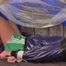 Alina tied and gagged in a princess bed standing in an old cellar wearing hot shiny nylon shorts and rainjacket (Video)