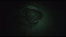 Jill tied, gagged and hooded on a cellar floor wearing a shiny green rain pants and a shiny black down jacket (Video)