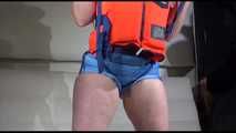 Sexy Jill shows you how to enjoy putting on and wear a lifevest over an bikini and a shiny nylon shorts (Video)