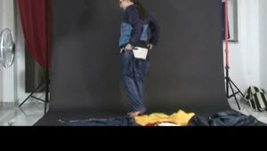 Anastasia posing infront of the camera wearing supersexy oldschool blue rainwear (Video)