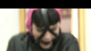 0310 min video with Jill in straight jacket and harnes gagged in shiny nylon shorts