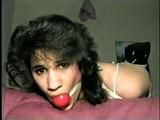 19 Yr OLD LATINA HOUSEWIFE WASHCLOTH MOUTH STUFFED, ACE BANDAGE WRAP GAGGED, BALL-GAGGED & HOG-TIED ON BED (D43-8)