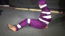 Sexy Sandra wearing a supersexy purple shiny nylon rainsuit bein tied and gagged and hooded on the floor with tape (Video)