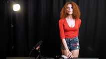 Skinny girl with wild red hair loves smoking a 120mm between the shooting