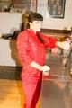 Jill posing sexy in an bar wearing sexy red shiny nylon rainwear (Pics)